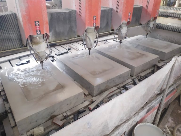 carving sinks out of stone blocks